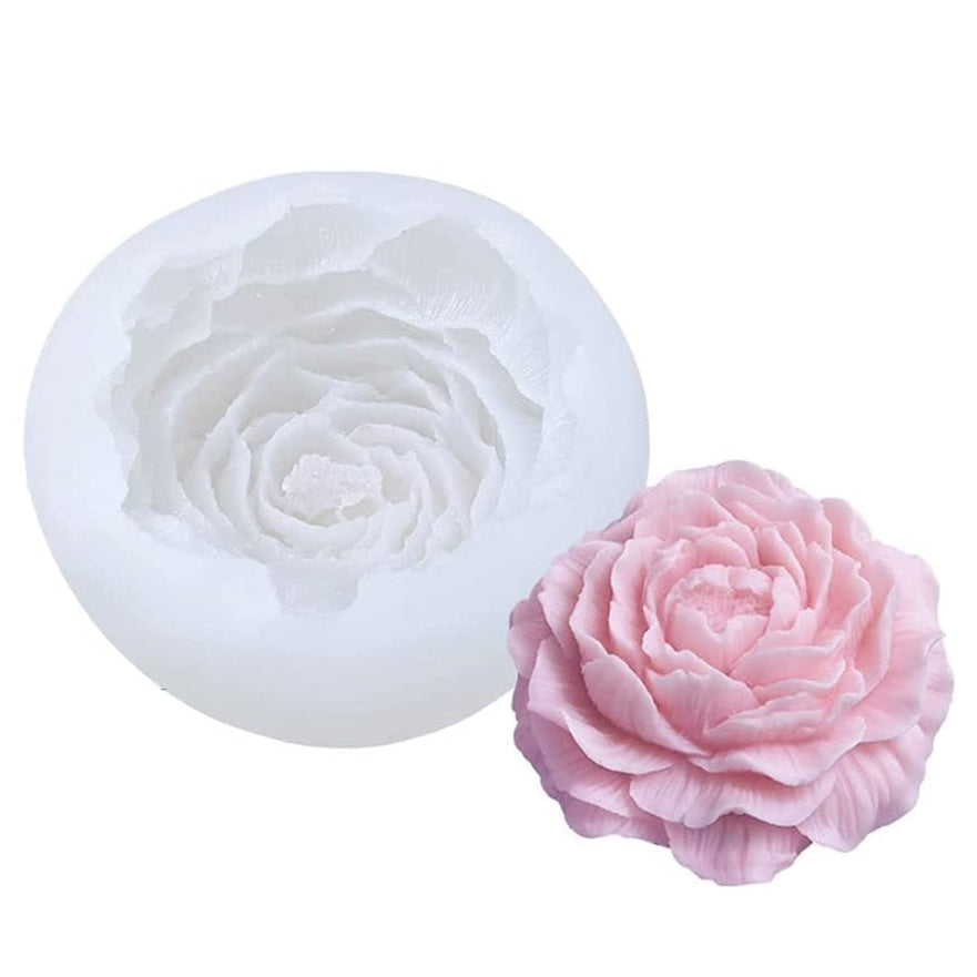 Silicone rose mold and a pink rose on a white background