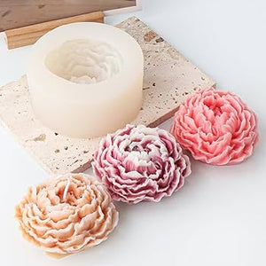Flower-shaped soap molds on a white surface